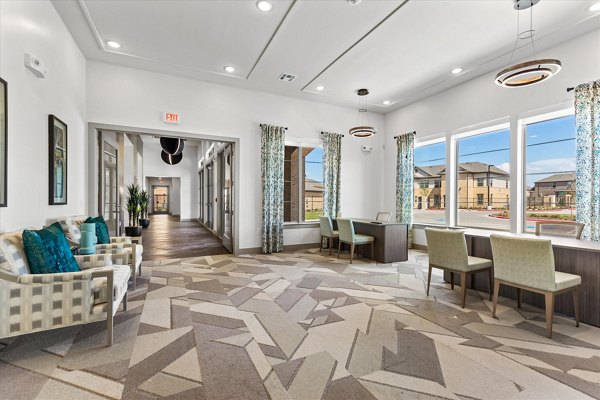Stylish clubhouse featuring modern decor at Emerson at Red Oak Apartments