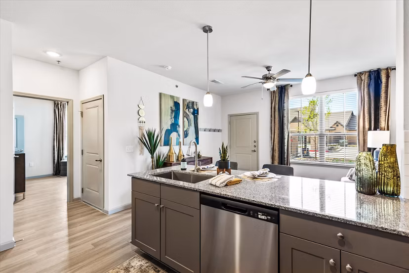 Modern kitchen with stainless steel appliances in Emerson at Red Oak Apartments