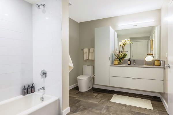 Luxury bathroom with sleek fixtures and modern design at The Sur Apartments