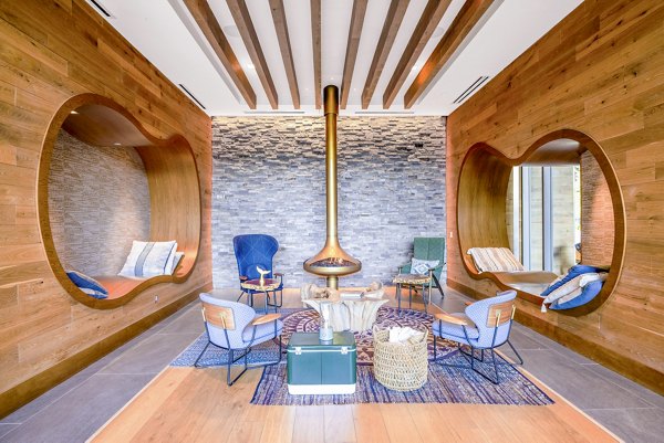 Clubhouse at The Sur Apartments with modern decor and seating areas