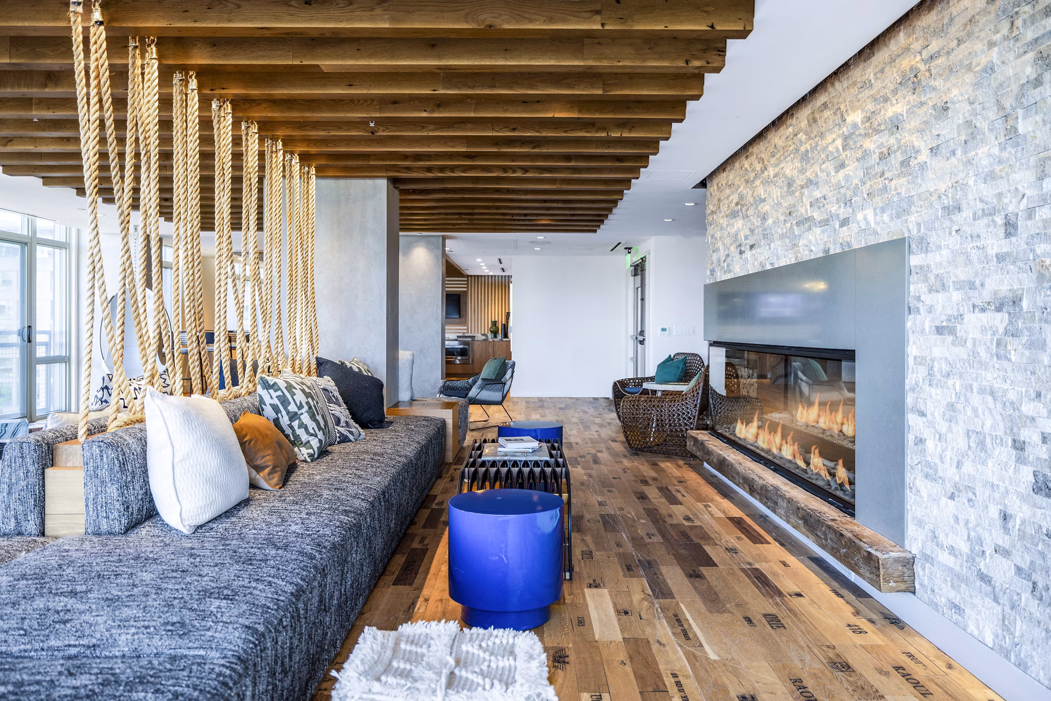 Clubhouse with modern decor at The Sur Apartments, offering luxurious communal spaces for socializing and relaxation near Greystar properties