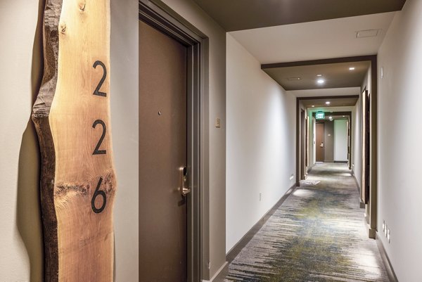 Clubhouse featuring modern design and seating areas at The Sur Apartments