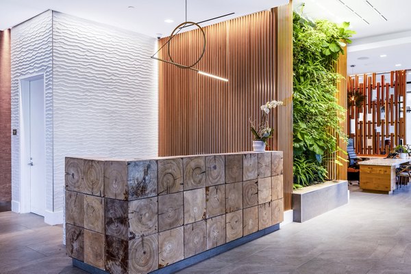 Elegant clubhouse lobby with modern decor at The Sur Apartments, a luxury Greystar property offering premium amenities and stylish living spaces