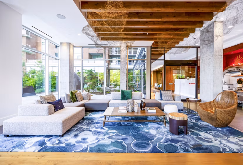 Clubhouse featuring modern design and coworking spaces at The Sur Apartments