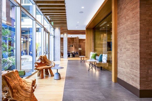 Clubhouse featuring modern seating and entertainment areas at The Sur Apartments