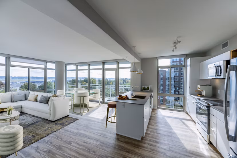 Modern kitchen with stainless steel appliances at The Sur Apartments in luxury Greystar community