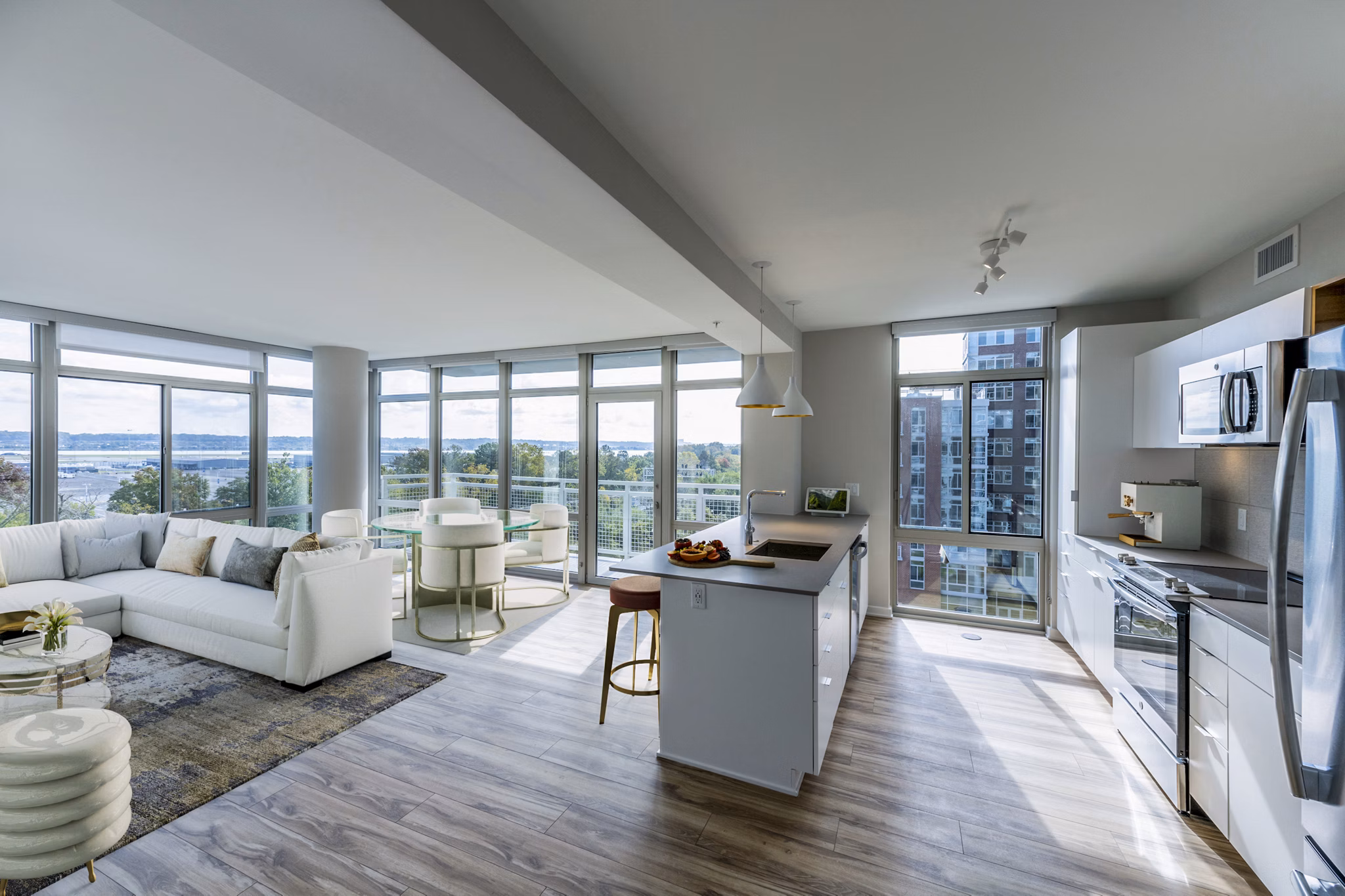 Modern kitchen with stainless steel appliances at The Sur Apartments in luxury Greystar community