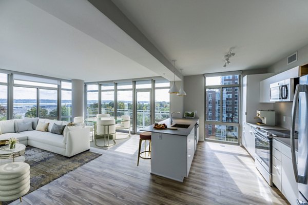 Modern kitchen with stainless steel appliances at The Sur Apartments in luxury Greystar community