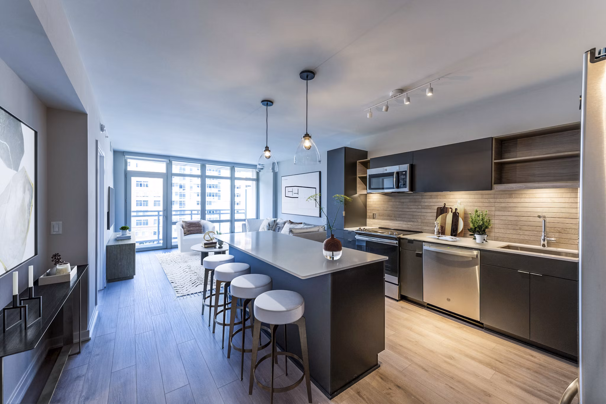 Kitchen featuring modern appliances and stylish cabinetry at The Sur Apartments