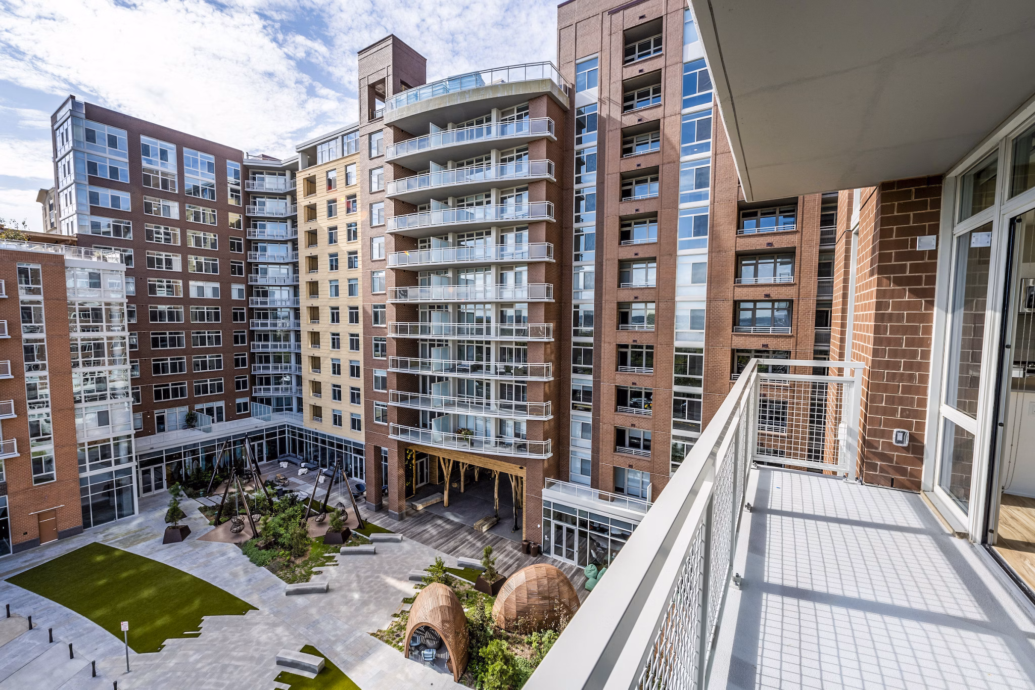 Private balcony with scenic views at The Sur Apartments, luxury living space ideal for relaxation and entertainment