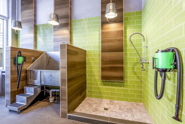 Dog wash station at The Sur Apartments, a convenient amenity for residents with pets offering easy grooming solutions in a luxury setting