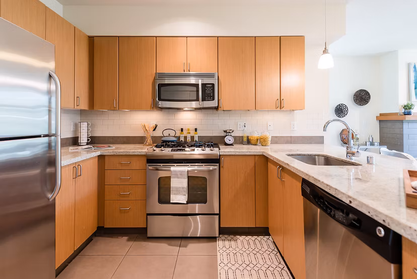 Modern kitchen with stainless steel appliances at Thornton Place Apartments, Greystar luxury apartments in Seattle