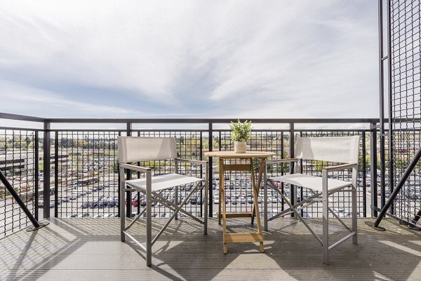 Scenic patio with modern seating at Thornton Place Apartments