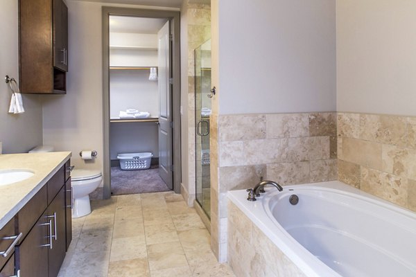 Modern bathroom with sleek fixtures at mResidences Miracle Mile Apartments