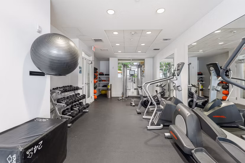 State-of-the-art fitness center at mResidences Miracle Mile Apartments with modern equipment for a complete workout experience