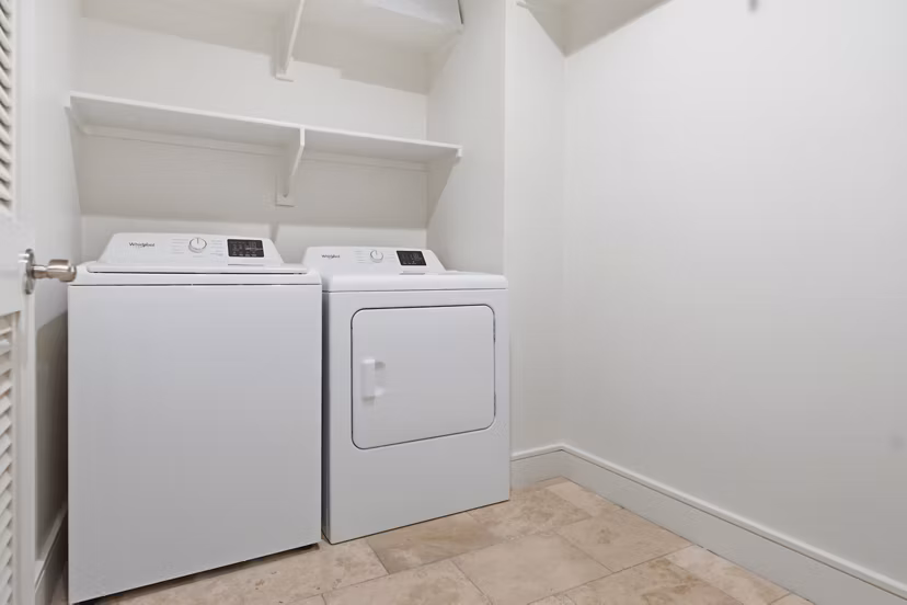 Laundry room with modern appliances at mResidences Miracle Mile Apartments