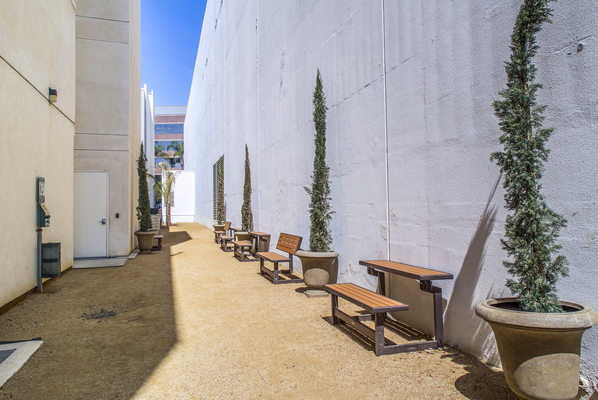 Spacious patio with modern seating at mResidences Miracle Mile Apartments
