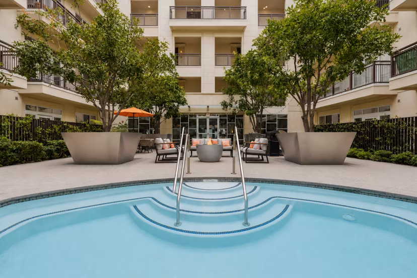 Cozy fire pit and jacuzzi area at mResidences Miracle Mile Apartments