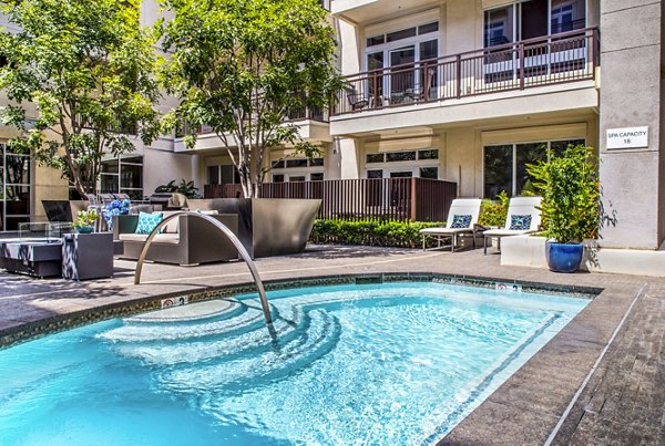 Elegant pool area at mResidences Miracle Mile Apartments offering luxury relaxation in the heart of the city