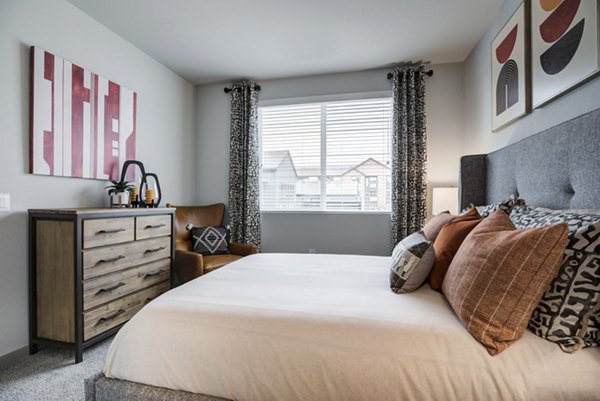 Cozy bedroom with modern decor at Outlook Briargate Apartments