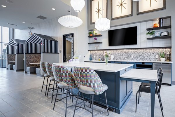 Clubhouse with modern seating and fireplace at Outlook Briargate Apartments