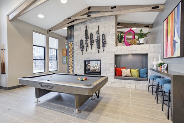 Game room with pool table and lounge area at Outlook Briargate Apartments, luxury living experience for residents in vibrant community