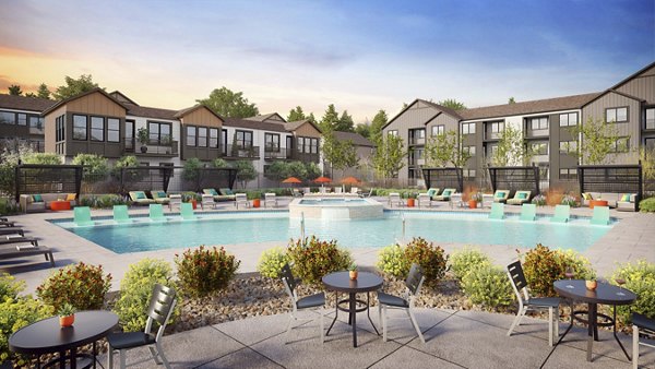 Luxurious pool with lounge chairs at Outlook Briargate Apartments in Colorado Springs, offering a relaxing retreat