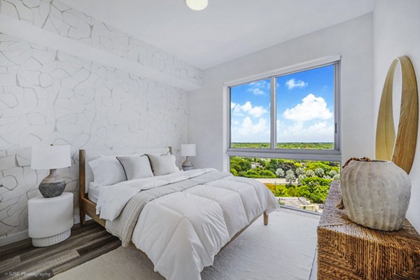 Bedroom with modern furnishings at Crest at Pinecrest Apartments, featuring a stylish design and natural light in luxury property