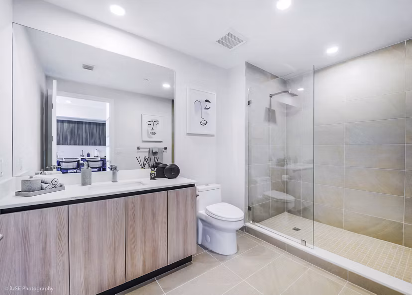 Crest at Pinecrest Apartments: Modern bathroom with sleek finishes and ample lighting