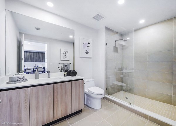 Crest at Pinecrest Apartments: Modern bathroom with sleek finishes and ample lighting