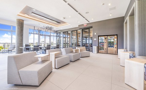 Beckon Apartments: Modern clubhouse with stylish seating area and vibrant decor