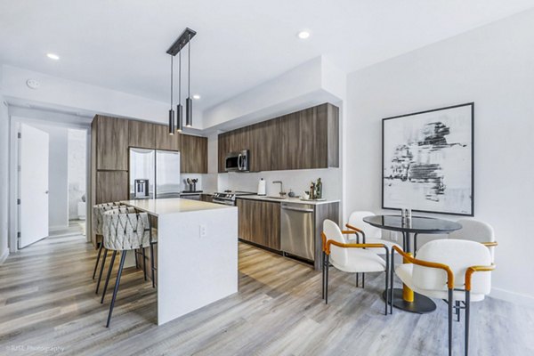 Dining room with elegant lighting and modern decor at Crest at Pinecrest Apartments, a Greystar luxury apartment community