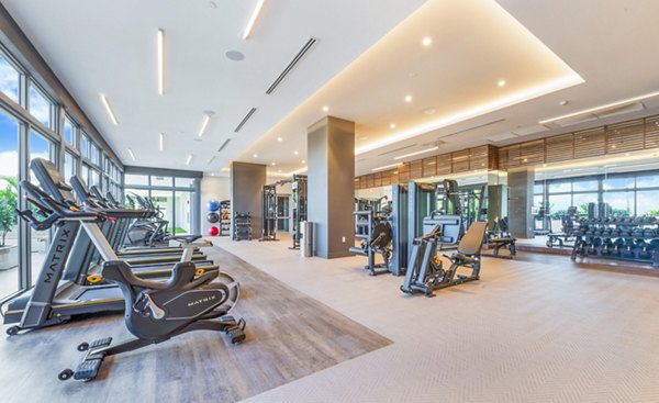 State-of-the-art fitness center at Crest at Pinecrest Apartments with modern equipment and spacious workout areas
