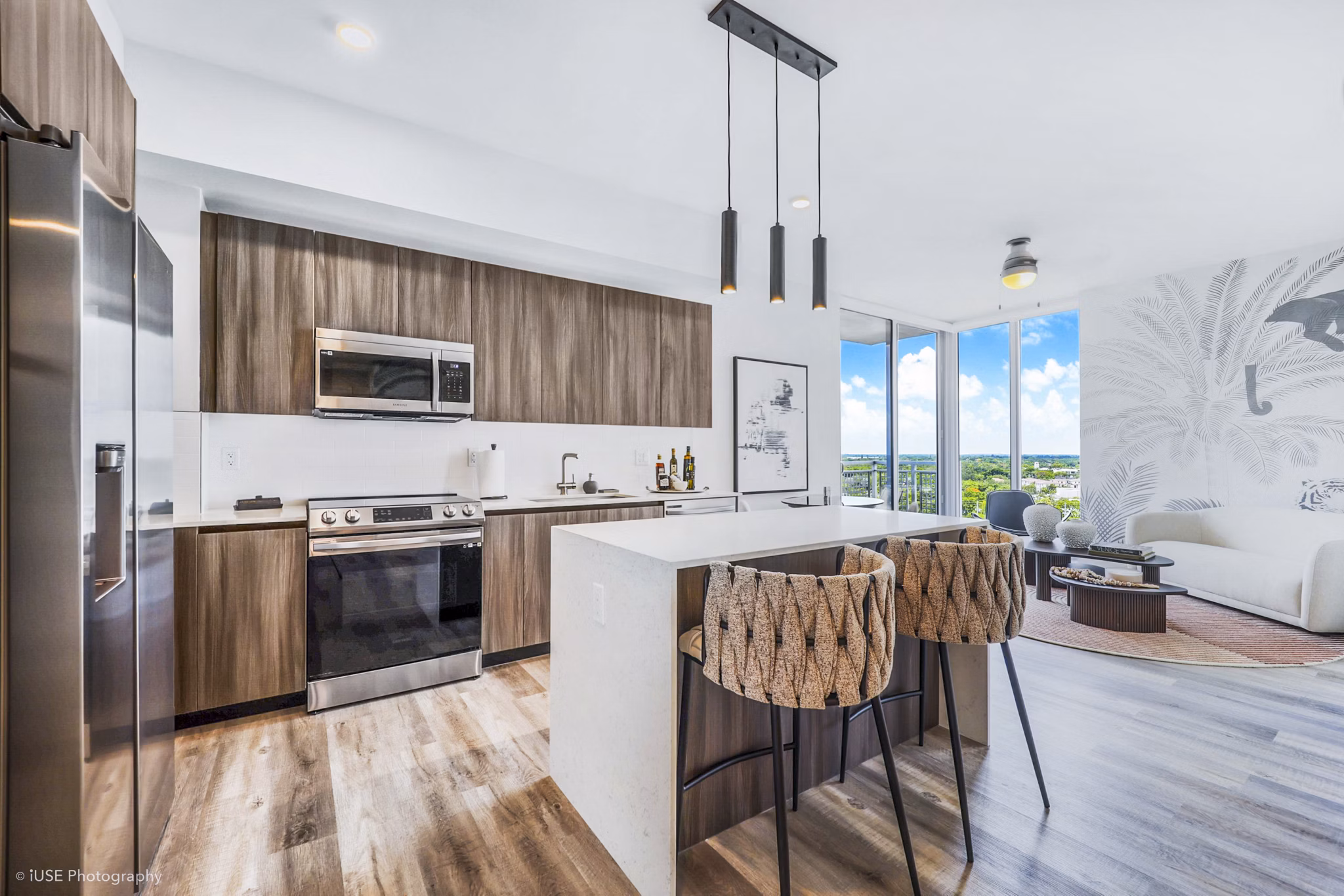 Modern kitchen with stainless steel appliances at Crest at Pinecrest Apartments
