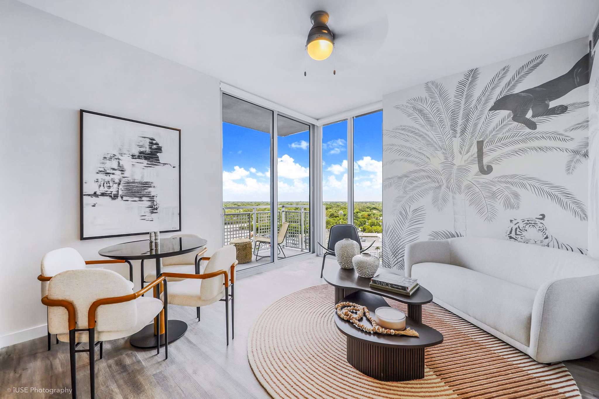 Spacious living room with modern furnishings at Crest at Pinecrest Apartments