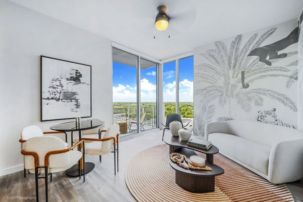 Spacious living room with modern furnishings at Crest at Pinecrest Apartments