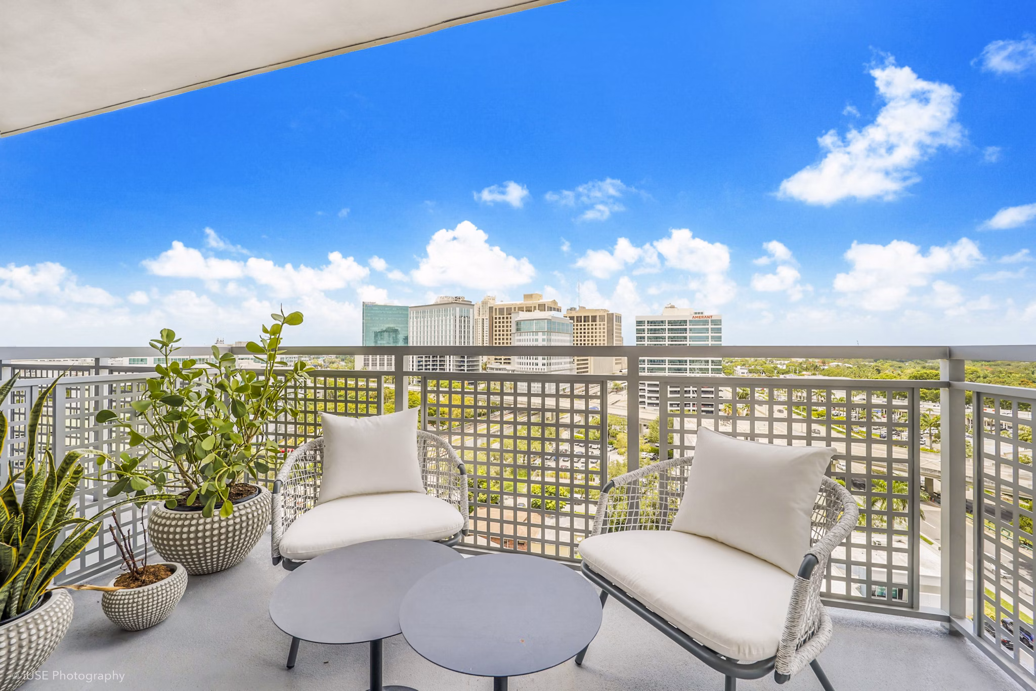 Expansive patio with outdoor seating at Crest at Pinecrest Apartments, perfect for relaxation and enjoying the view