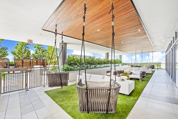 Patio with modern outdoor seating at Crest at Pinecrest Apartments, a luxury Greystar community