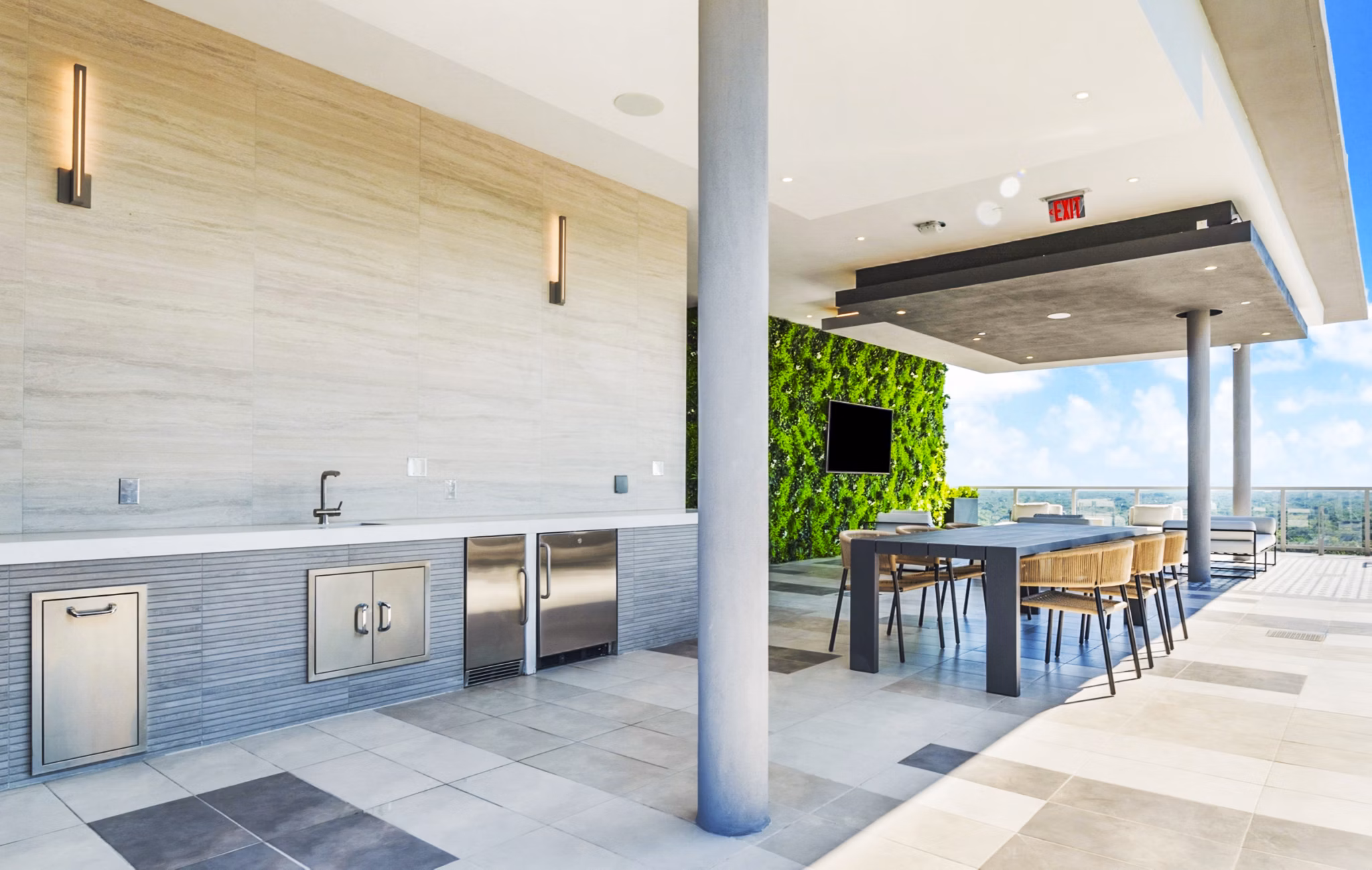 Grill area with outdoor seating at Crest at Pinecrest Apartments