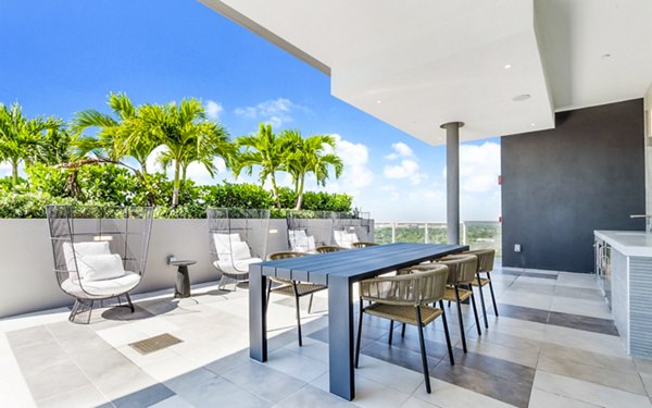 Spacious patio with outdoor seating at Crest at Pinecrest Apartments, perfect for relaxation and gatherings