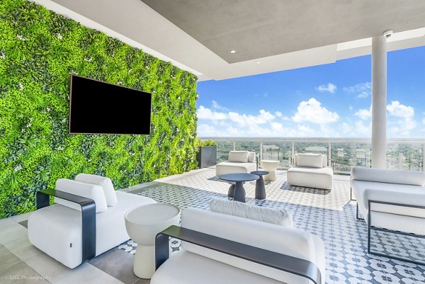 Crest at Pinecrest Apartments: Cozy patio with outdoor seating for relaxation and gatherings