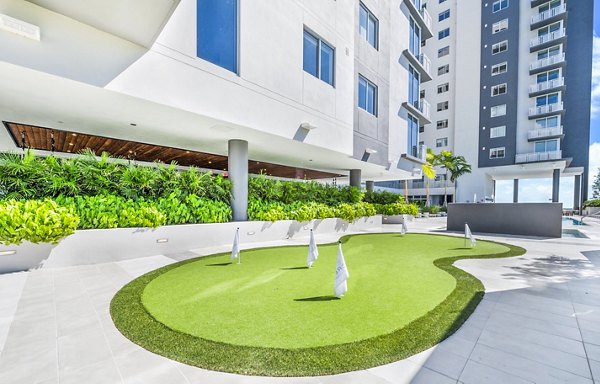 Putting green for golf enthusiasts at Crest at Pinecrest Apartments, providing luxury outdoor recreation spaces for residents