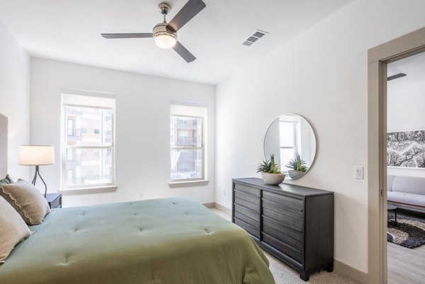 Bedroom featuring luxurious decor in Alexan Braker Pointe Apartments