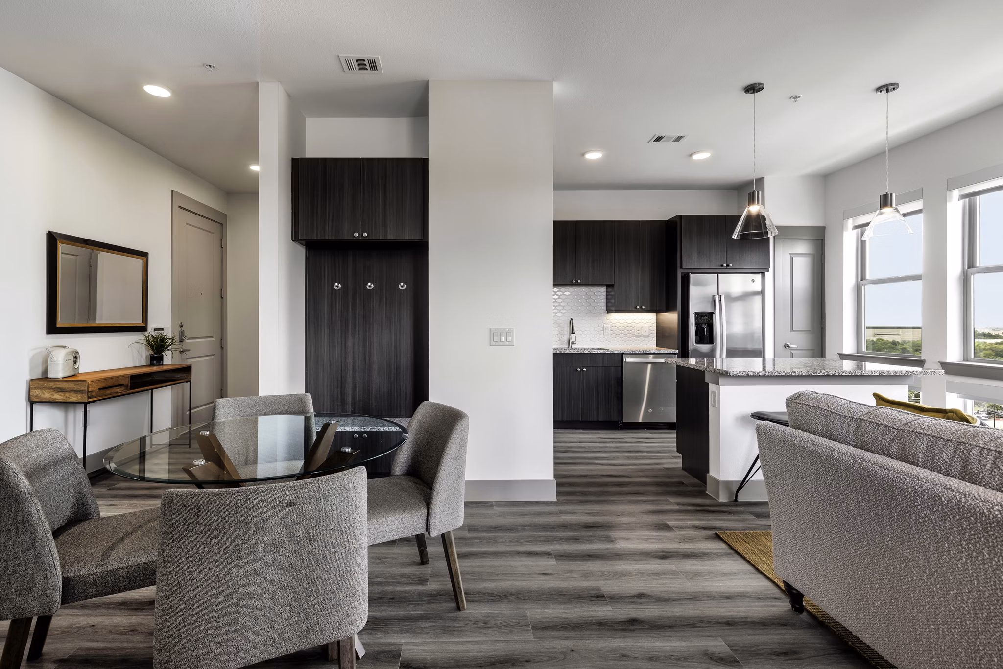 Dining area with modern furniture at Alexan Braker Pointe Apartments, a luxury community by Greystar Luxury Apartments in vibrant city of Austin