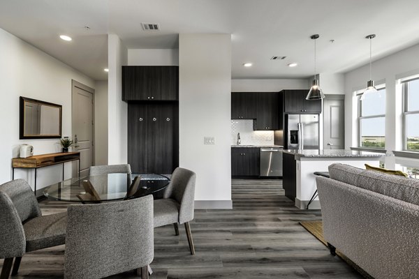 Dining area with modern furniture at Alexan Braker Pointe Apartments, a luxury community by Greystar Luxury Apartments in vibrant city of Austin