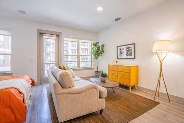 Stylish kitchen with stainless steel appliances in Alexan Braker Pointe Apartments