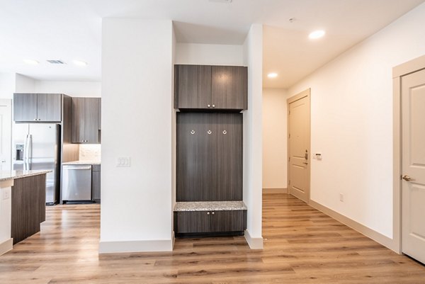 Modern kitchen with stainless steel appliances at Alexan Braker Pointe Apartments