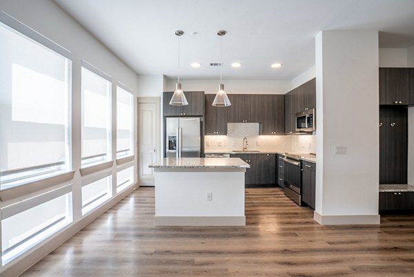 Spacious kitchen with modern appliances at Alexan Braker Pointe Apartments