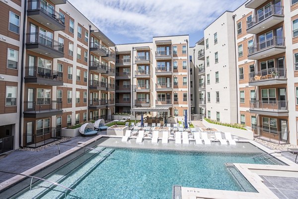 Rooftop pool with city views at Alexan Braker Pointe Apartments