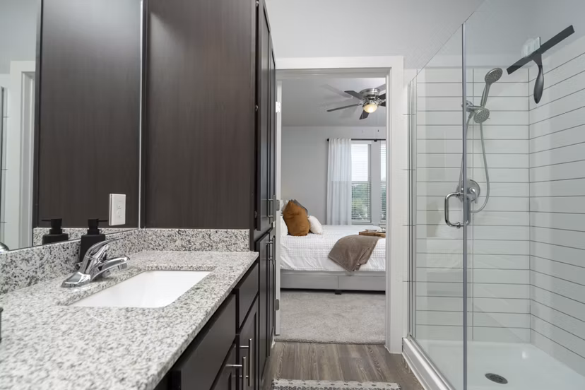 Luxurious bathroom with marble countertops at Sage Stone Oak Apartments